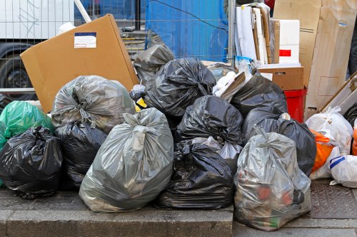 Workers segregating construction waste materials on-site