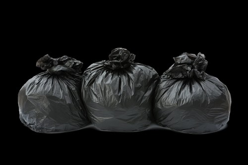 Recycling bins and sorted waste materials in a Central London commercial building.