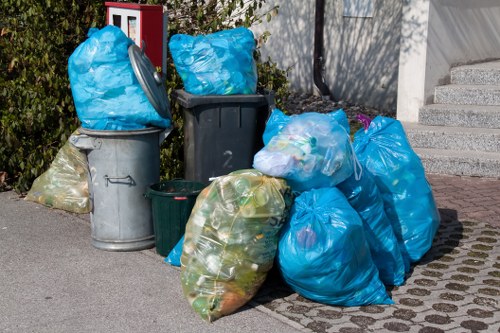 Experts handling electronic waste disposal in an office