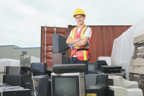 Professional waste clearance team removing household items